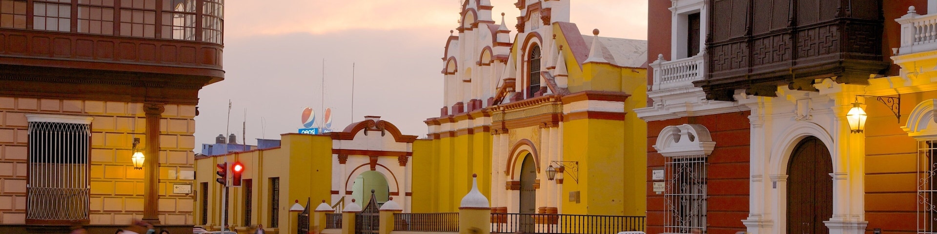 Trujillo Plaza de Armas featuring a sunset, a city and street scenes