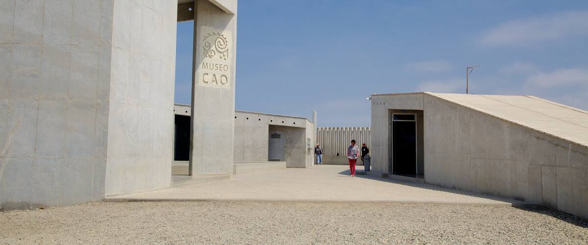 A modern architectural structure with a clear sky.