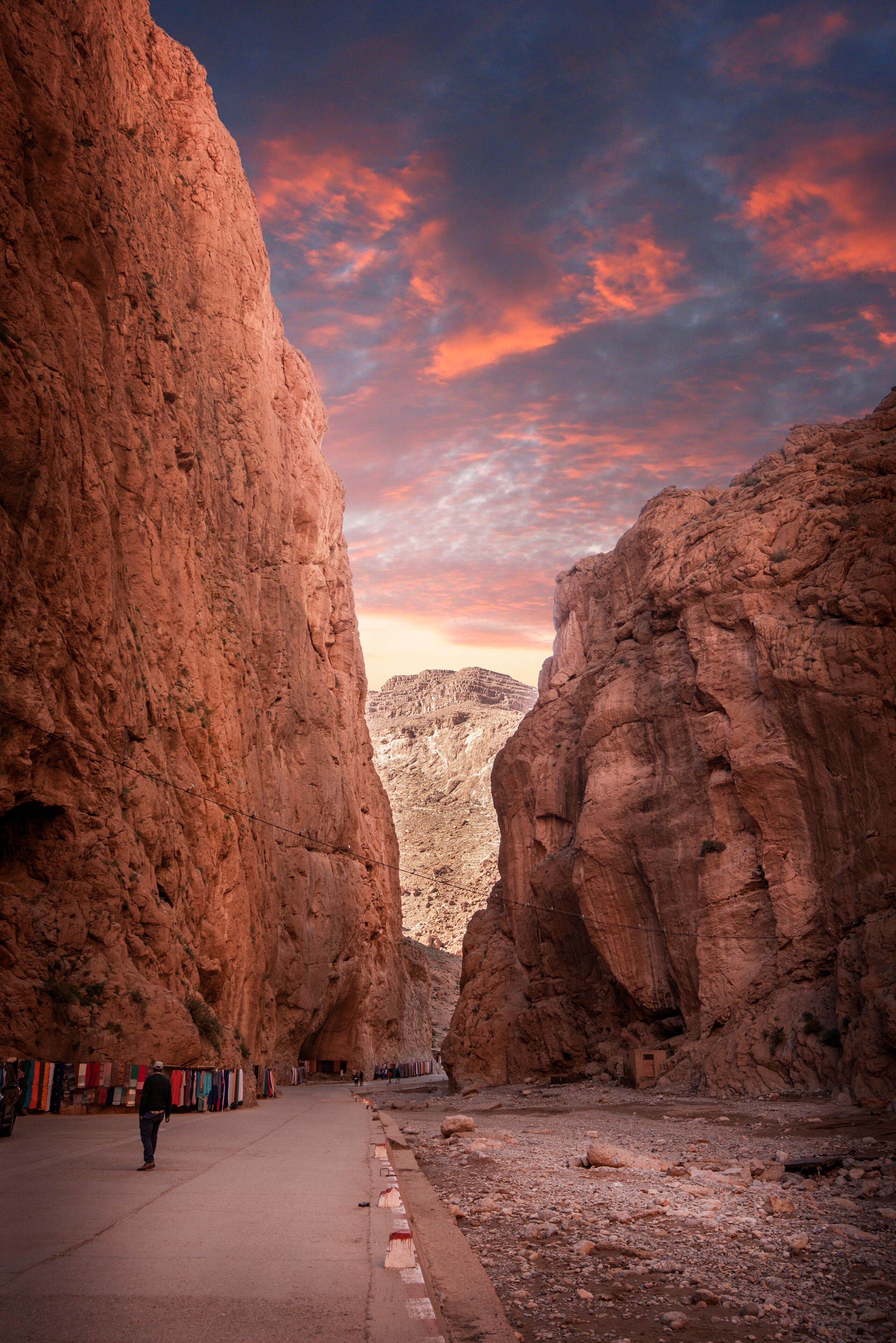 Todgha Gorge or Gorges du Toudra is a canyon in High Atlas Mountains near the town of Tinerhir, Morocco . A series of limestone river canyons, or wadi and neighbor of Dades Rivers at sunset