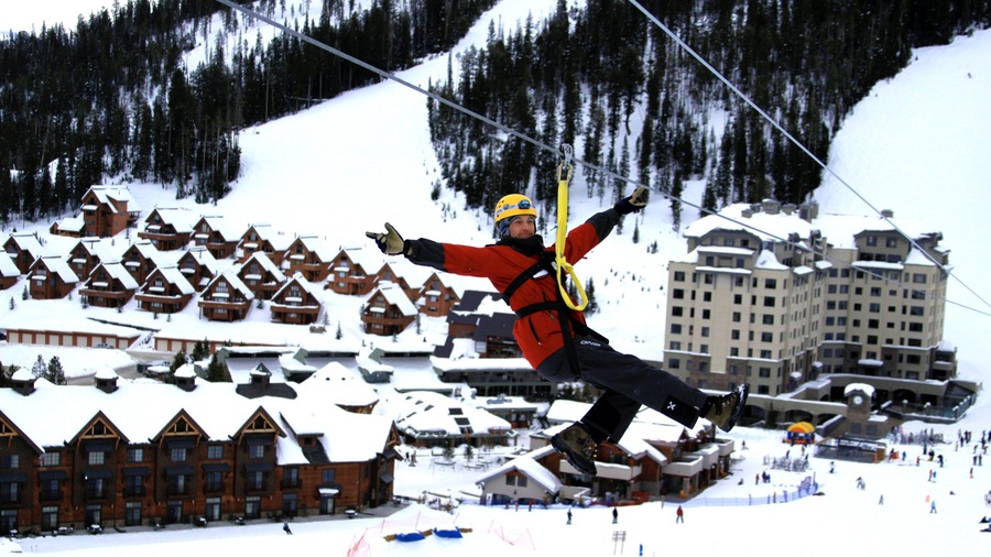 Big Sky Resort showing zip lining, a small town or village and snow