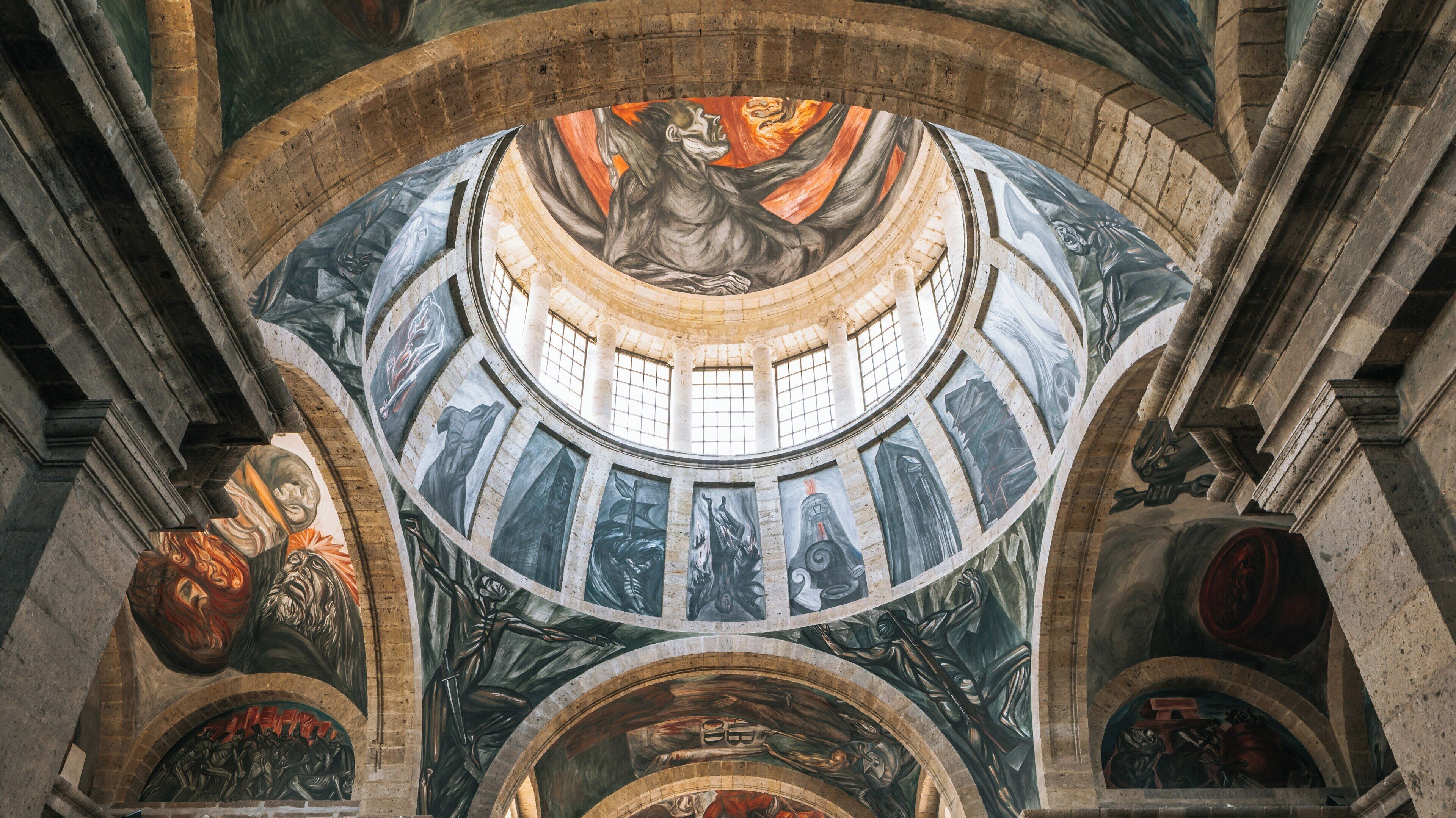Exploring the architectural beauty and vibrant murals of Hospicio Cabanas in Guadalajara, Jalisco, Mexico during a bright day