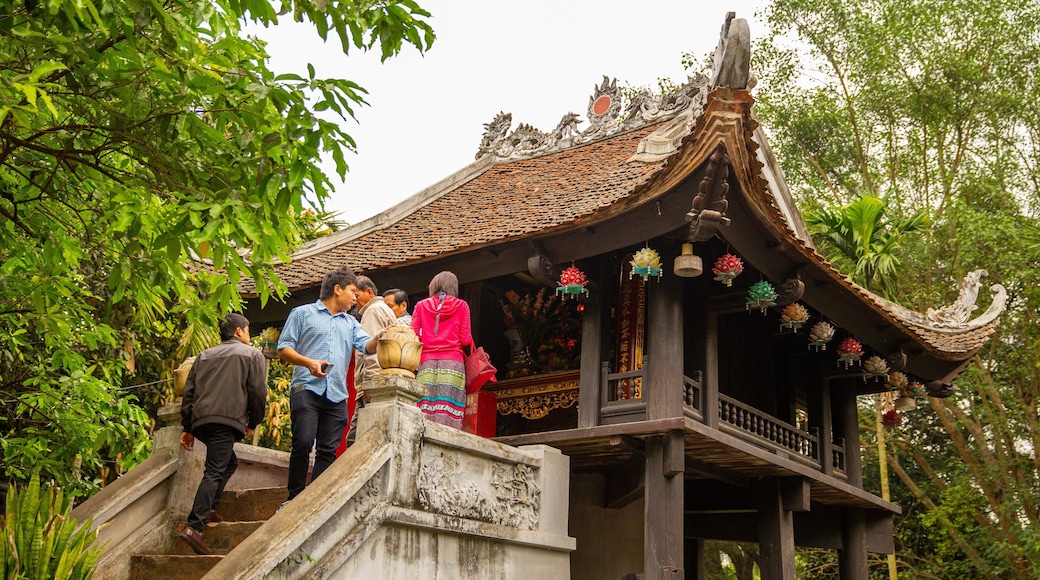 Ho Chi Minh Museum featuring heritage architecture as well as a small group of people