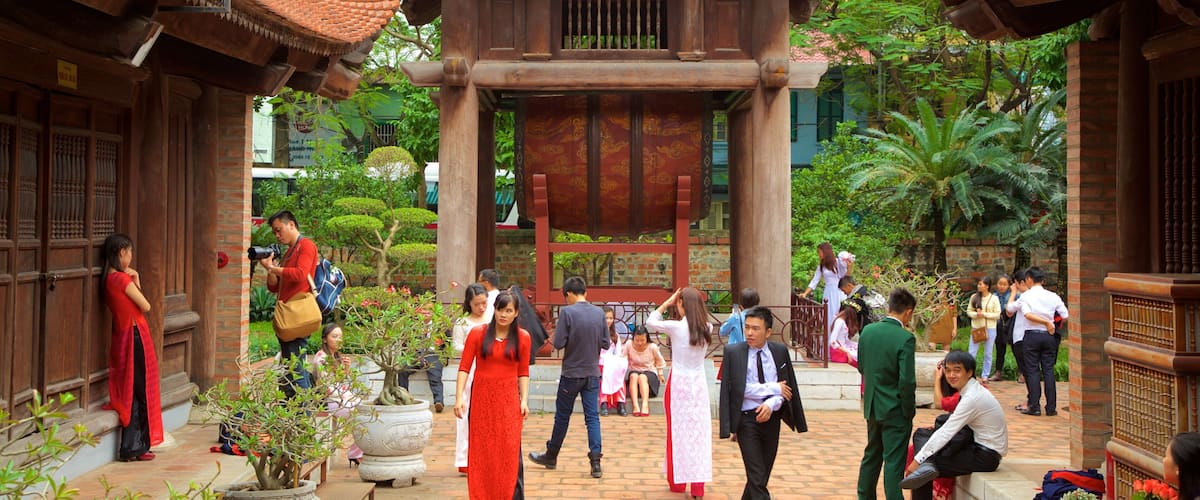 Temple of Literature showing a temple or place of worship as well as a large group of people
