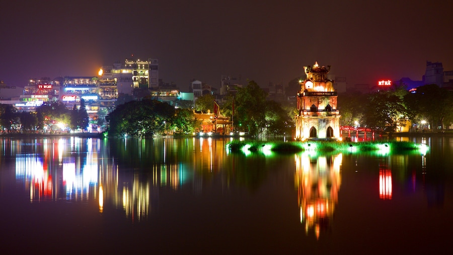 Hoan Kiem Lake featuring a lake or waterhole, night scenes and a city