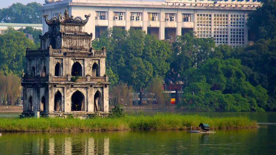 Hoan Kiem Lake showing a monument, heritage architecture and a lake or waterhole