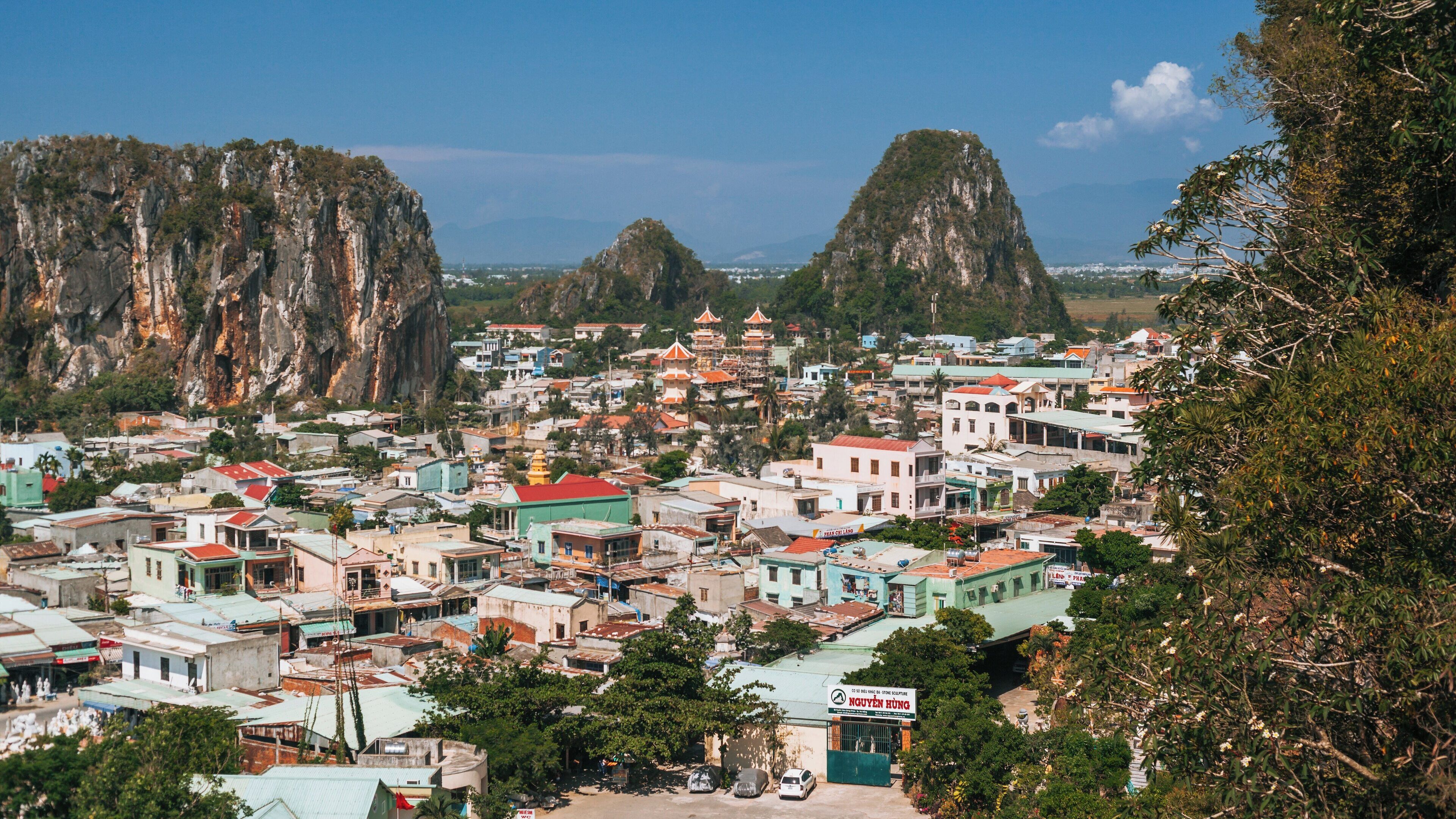 Breathtaking view of Marble Mountains and surrounding village in Hoa Hai, Vietnam showcasing stunning natural beauty and cultural heritage