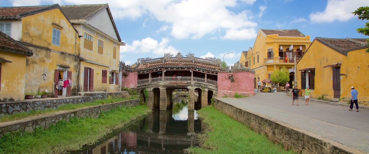 Japanese Bridge featuring a small town or village, a lake or waterhole and a bridge