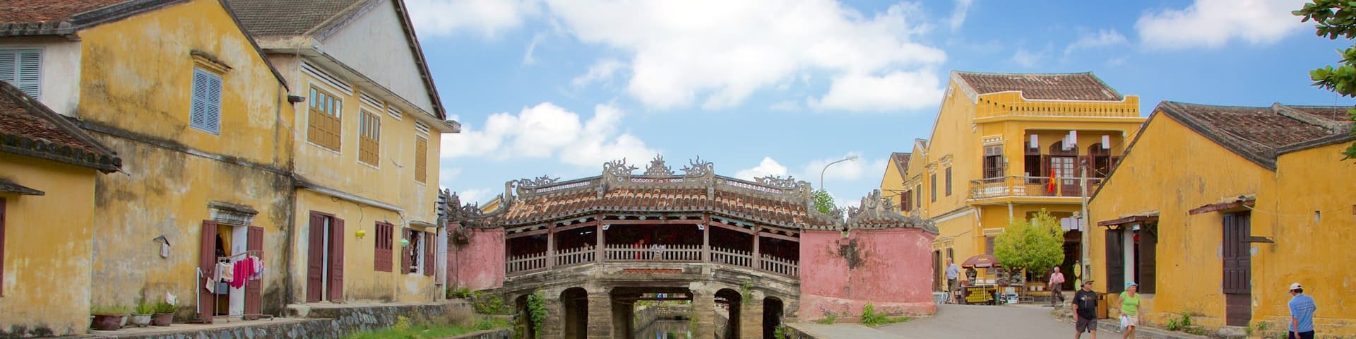 Japanese Bridge featuring a small town or village, a lake or waterhole and a bridge