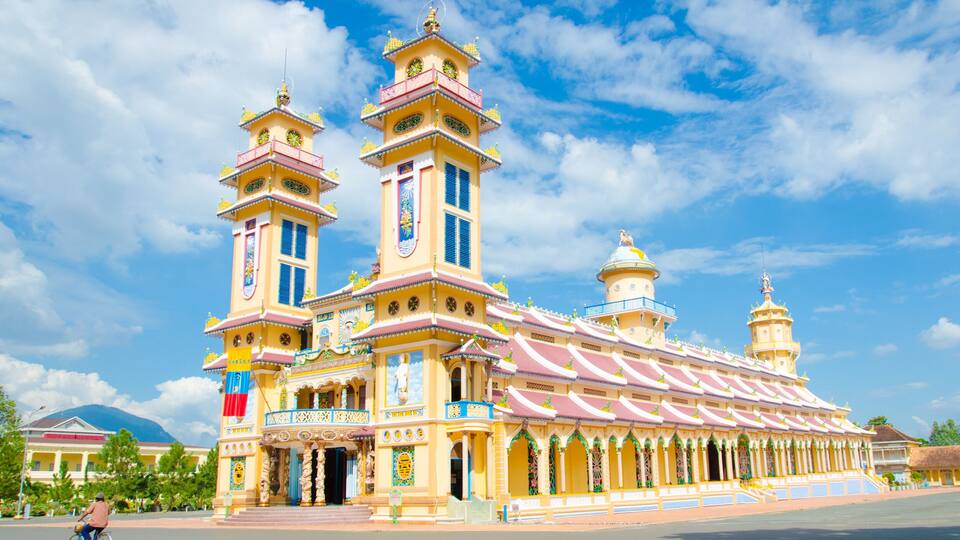 A colorful church with two towers and a large central building.