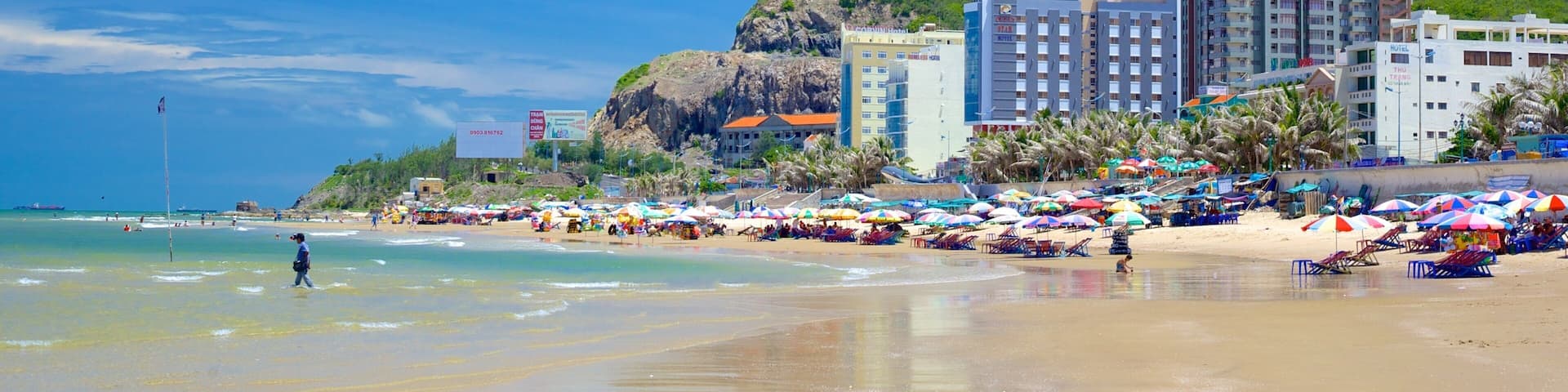 Back Beach which includes a sandy beach and a coastal town