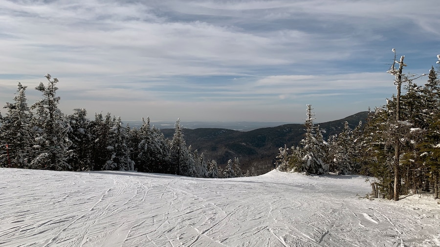 East Coast United States Ski Resort view from atop a snow covered mountain. Vermont Skiing and Snowboarding, recreational, winter sports.