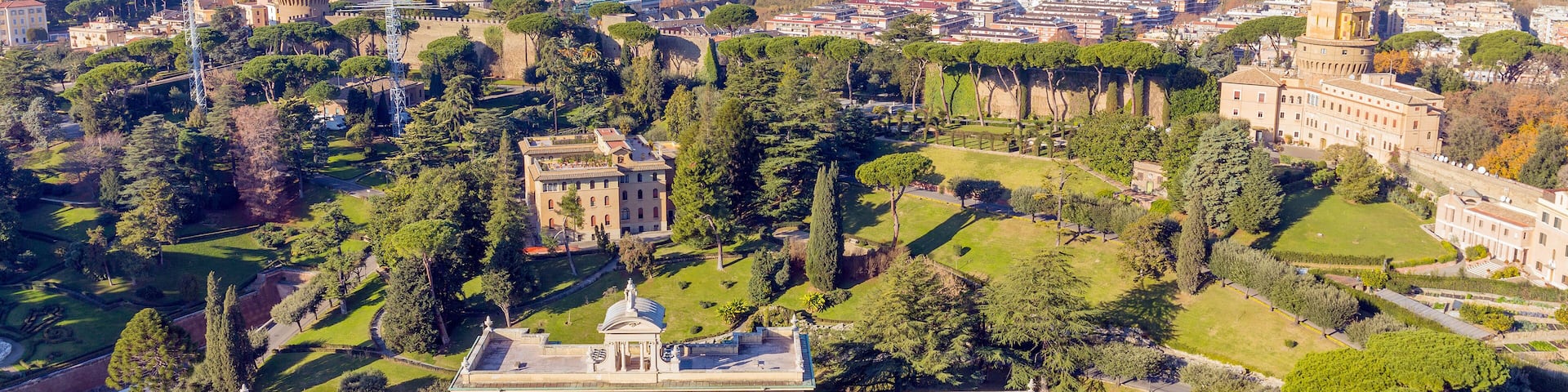 View at the Vatican Gardens and the Palace of the Governorate in Rome from the dome of St. Peter's basilica.