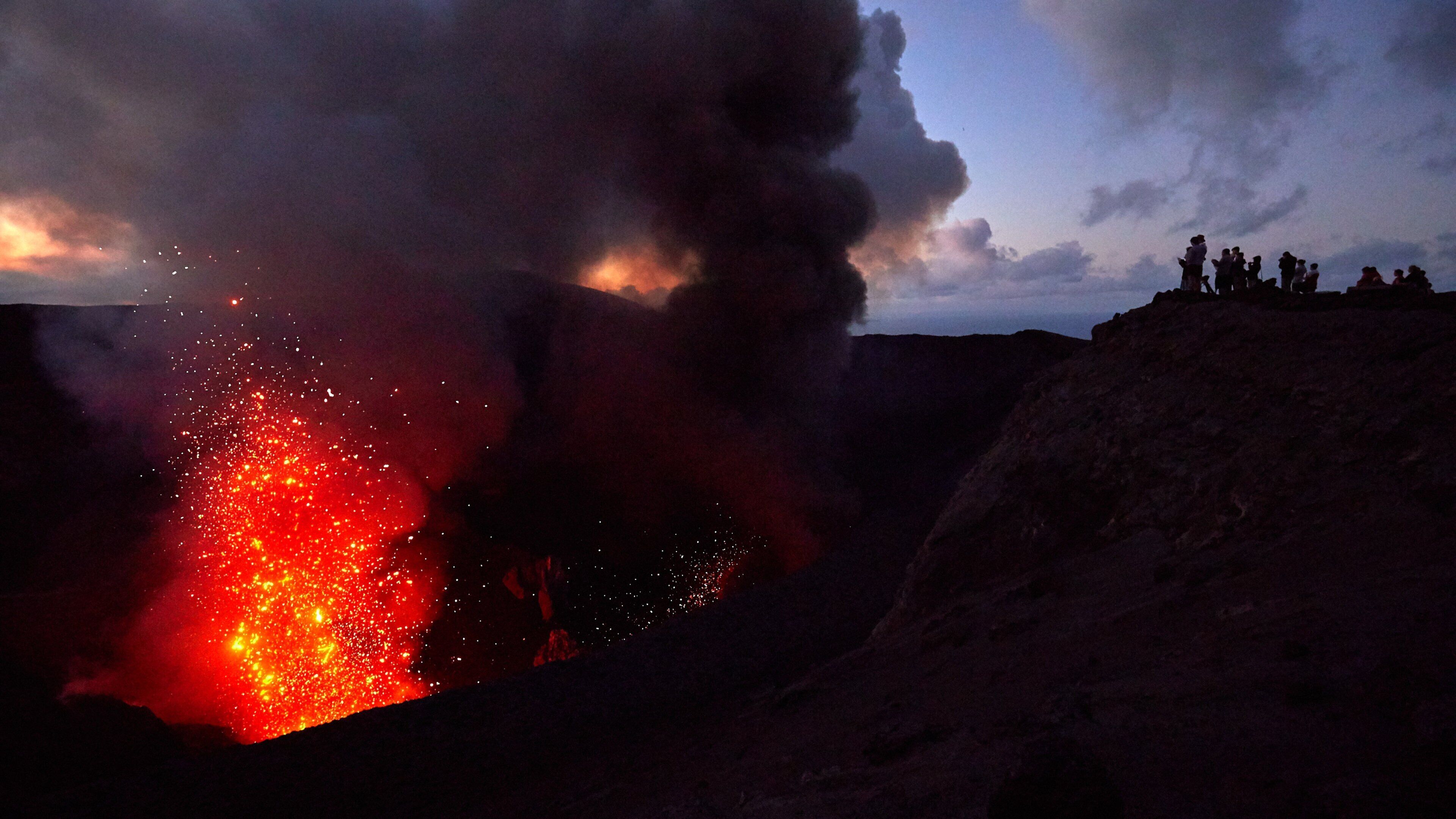 Mt. Yasur which includes a sunset and mountains
