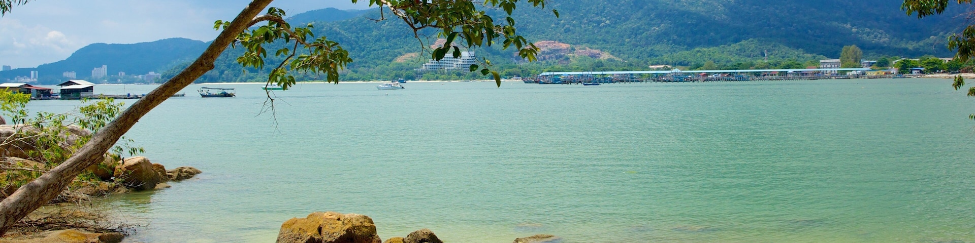 Penang National Park which includes a sandy beach, tropical scenes and a bay or harbor