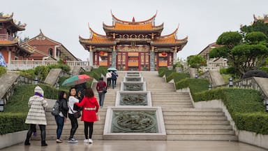 A-Ma Cultural Village featuring heritage elements and a garden as well as a small group of people