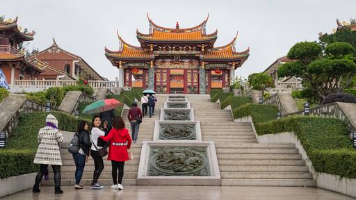 A-Ma Cultural Village featuring heritage elements and a garden as well as a small group of people