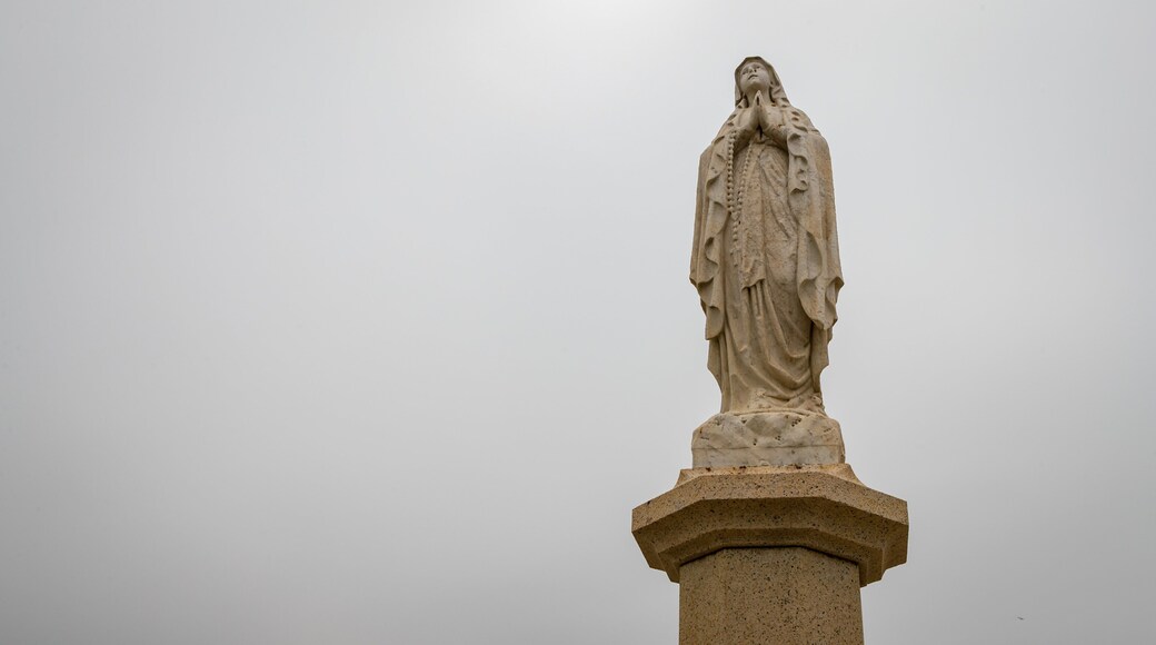 Chapel of our Lady of Penha showing a statue or sculpture and religious elements