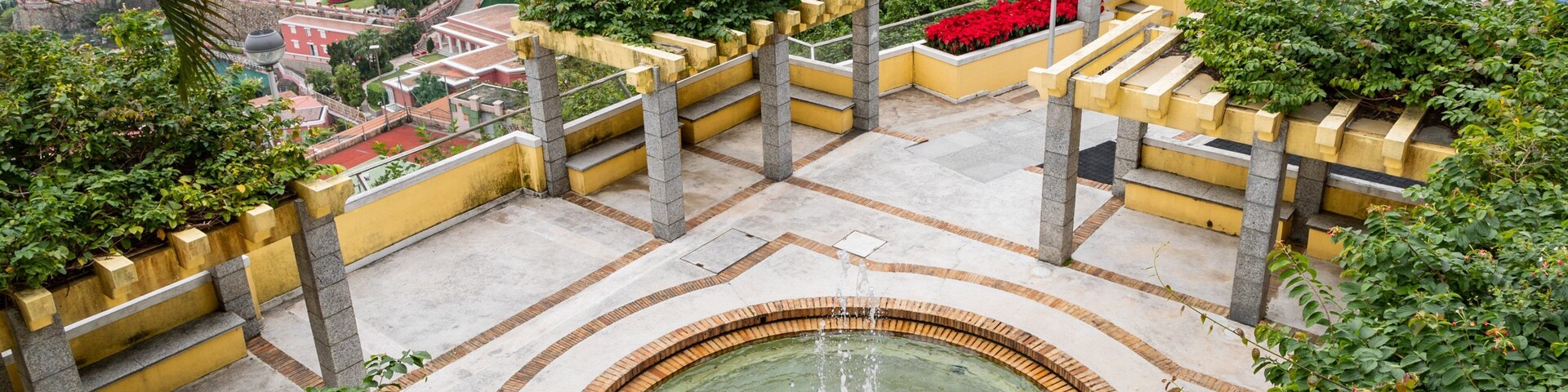 Chapel of our Lady of Penha featuring a fountain, a pond and landscape views