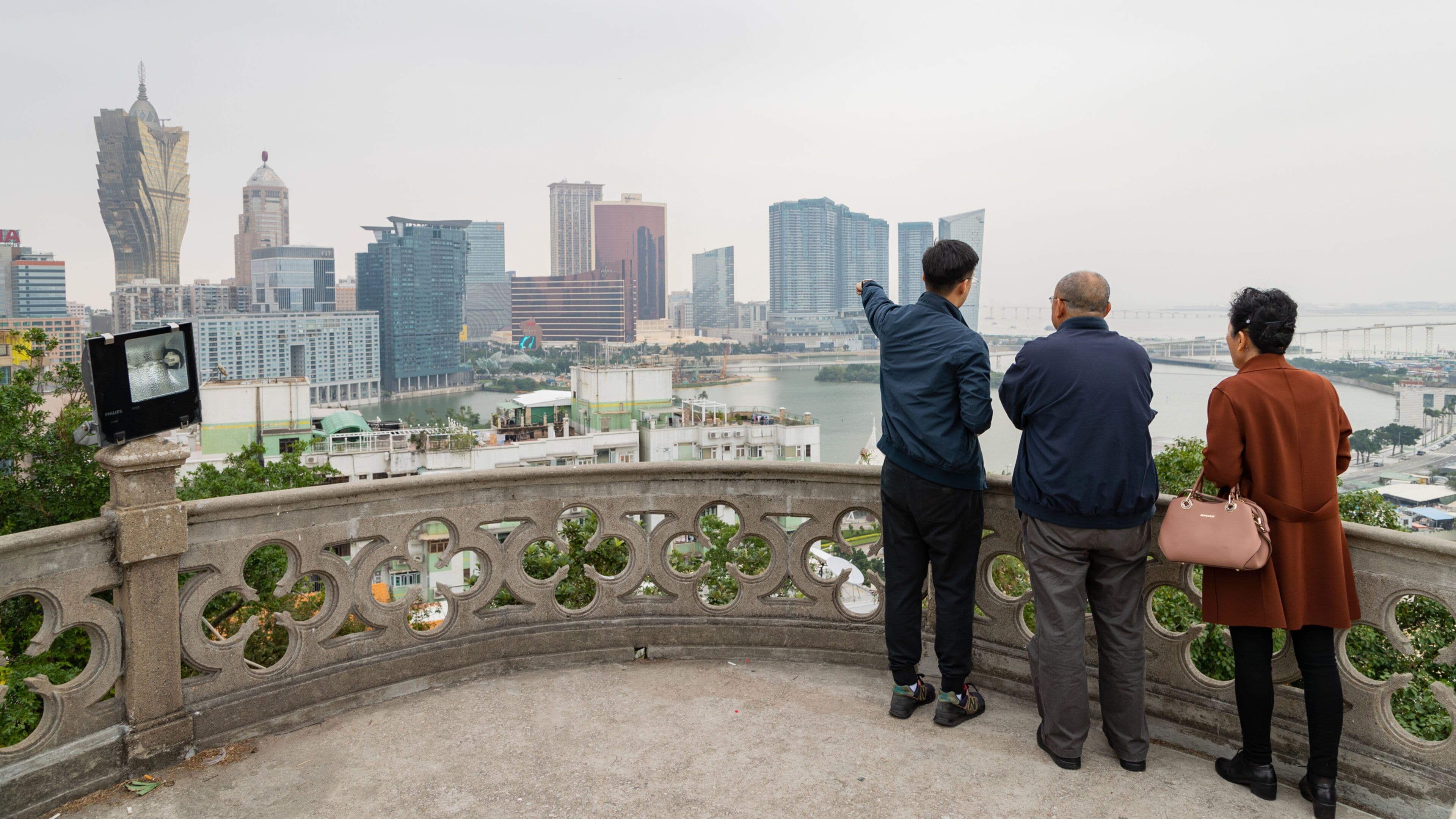 Chapel of our Lady of Penha showing a coastal town, a city and views