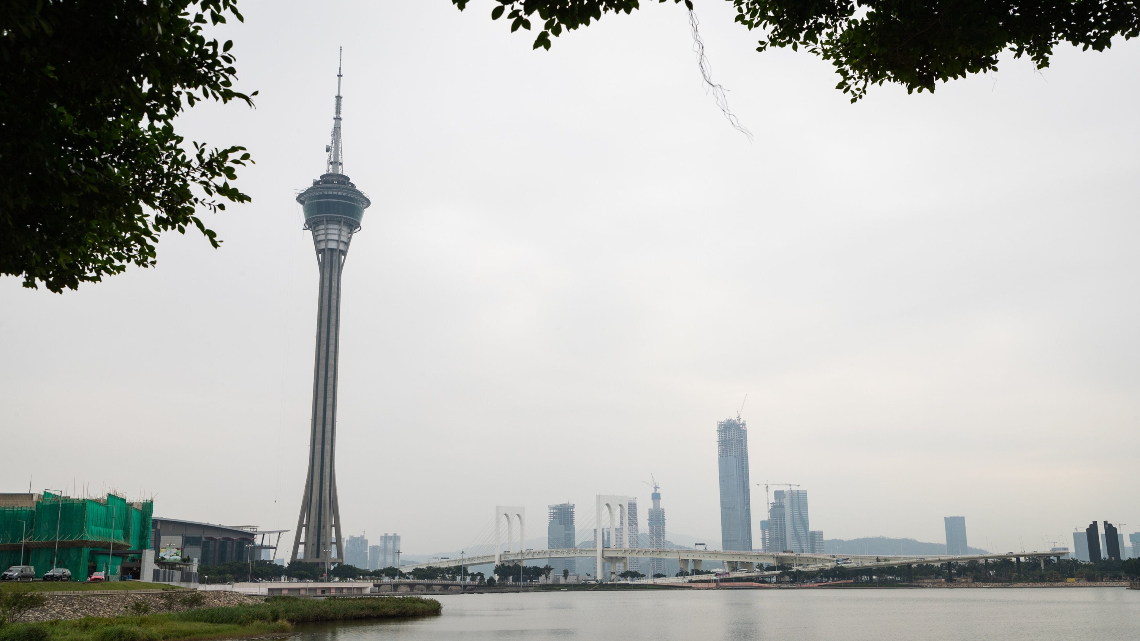 Macau Tower showing a city, landscape views and a skyscraper