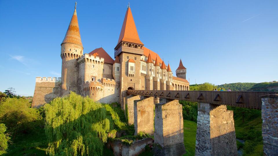A historic castle with multiple towers and a bridge.