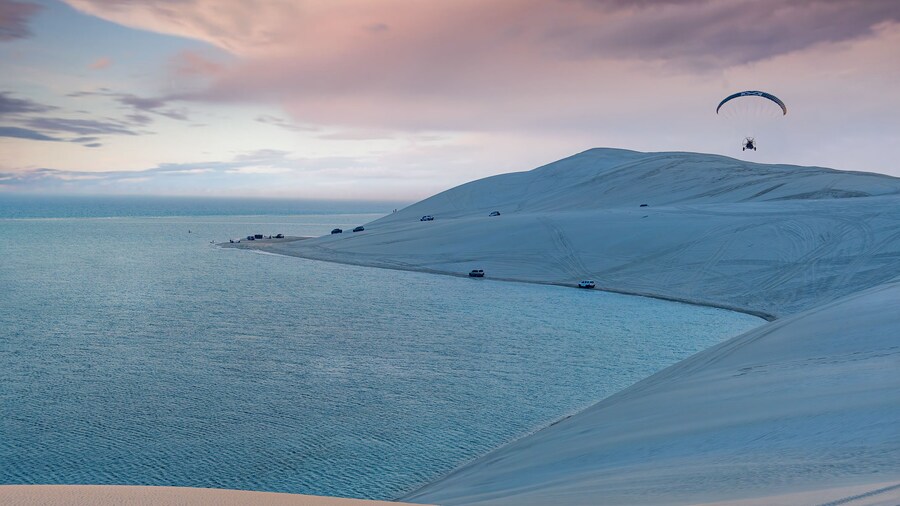 Desert at sunrise, morning glow over dunes inland sea of the Sea line Desert just out of Doha, Qatar.