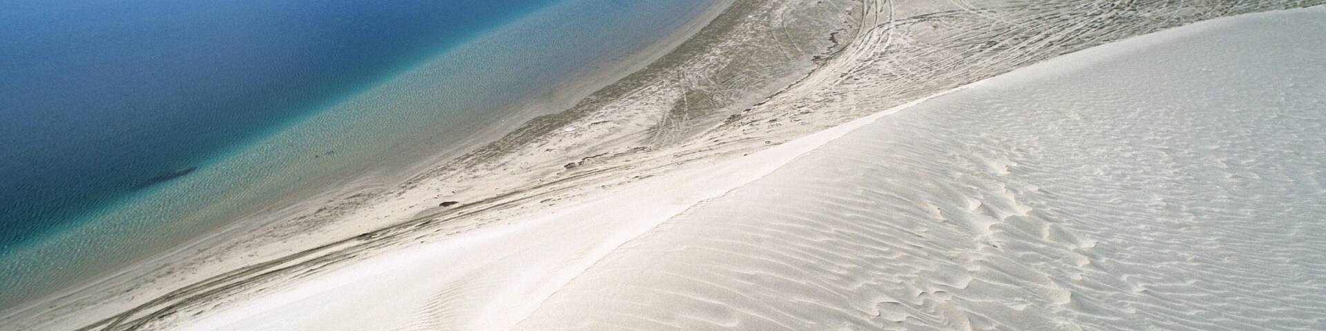 Dunes and sea. Khor Al Adaid. Qatar.
