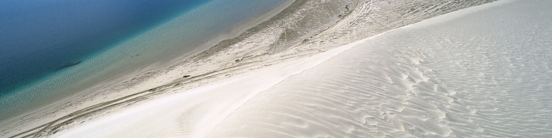 Dunes and sea. Khor Al Adaid. Qatar.
