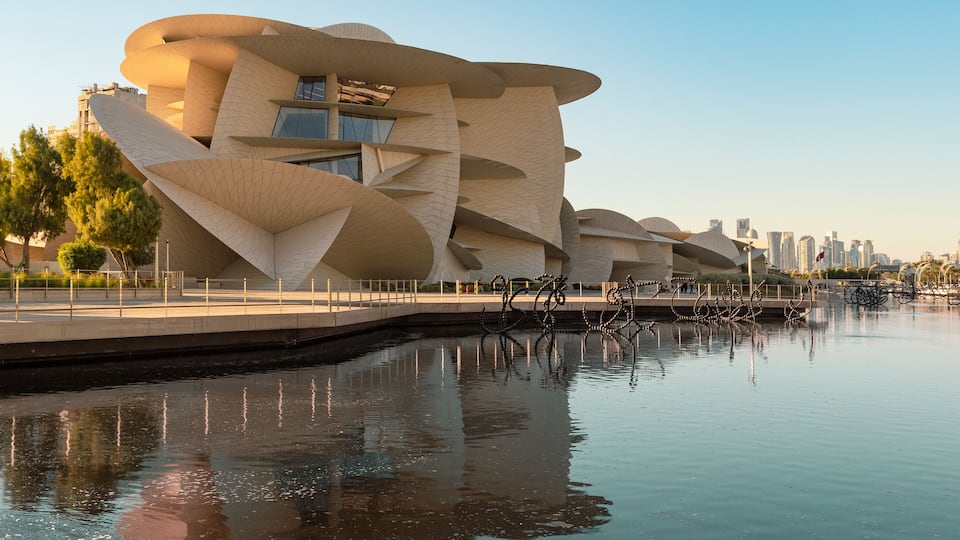 National Museum in Doha, Qatar with a wide angle view of the pool in its garden