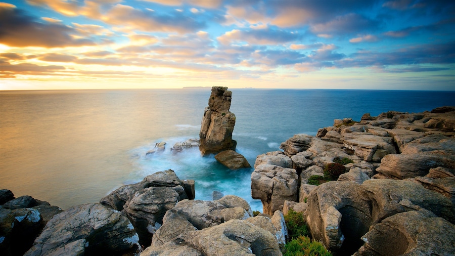 Cabo Carvoeiro which includes general coastal views, rugged coastline and a sunset
