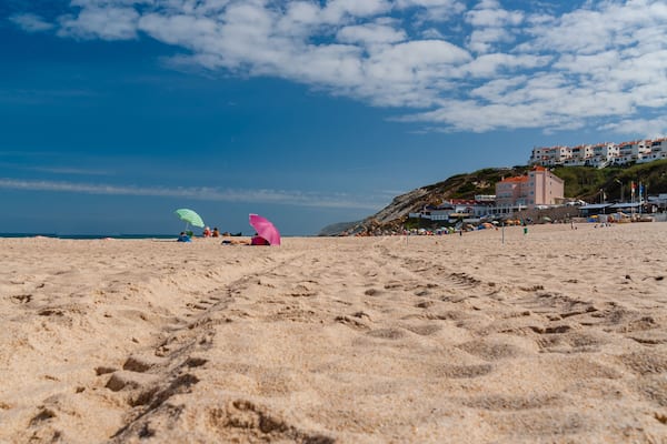 Rest on the sand beach. Summer photo near sea. Beach on Foz do Arelho, Portugal, Shutterstock ID 1072252235, Purchase Order: -
