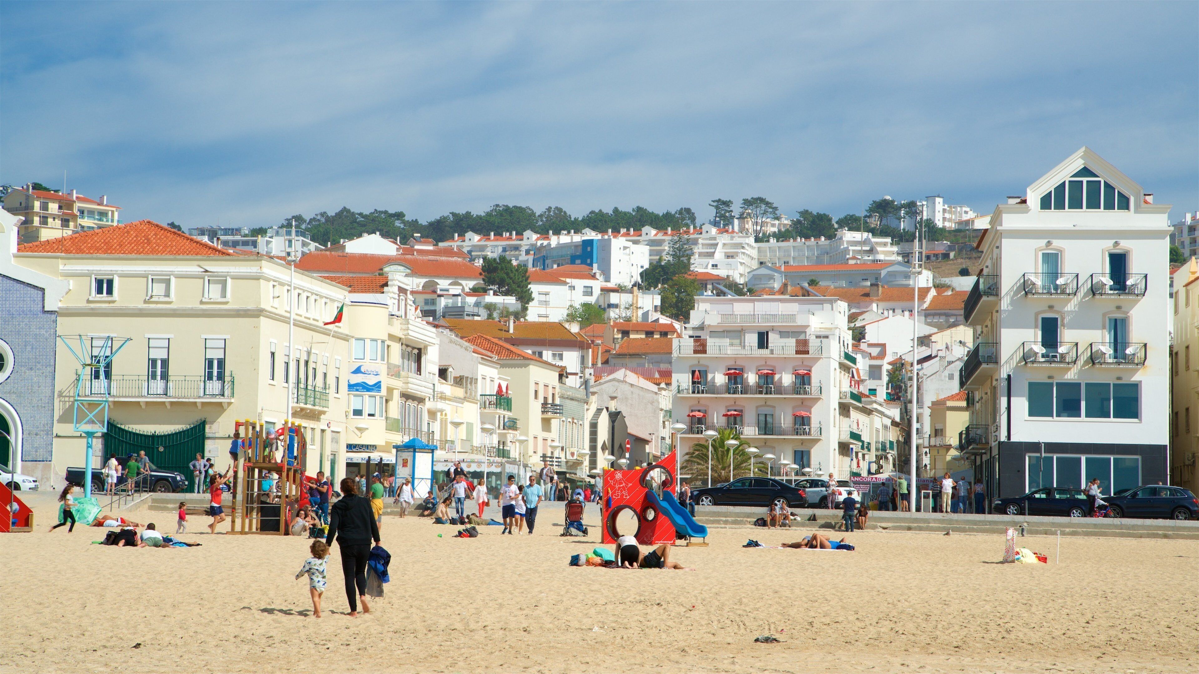 Nazare Beach featuring a beach and a coastal town