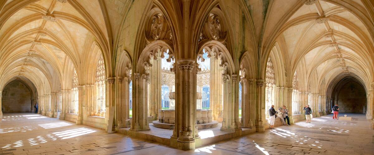 A cathedral interior with high vaulted ceilings and ornate columns.