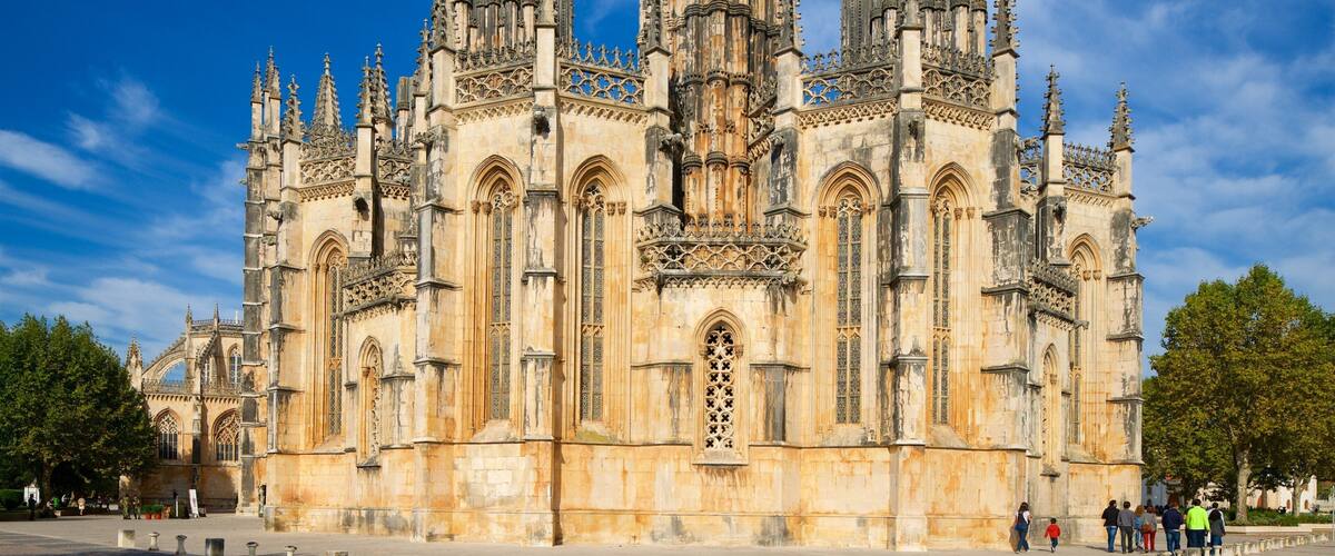 A historic cathedral with intricate Gothic architecture, including pointed arches and detailed stone carvings.