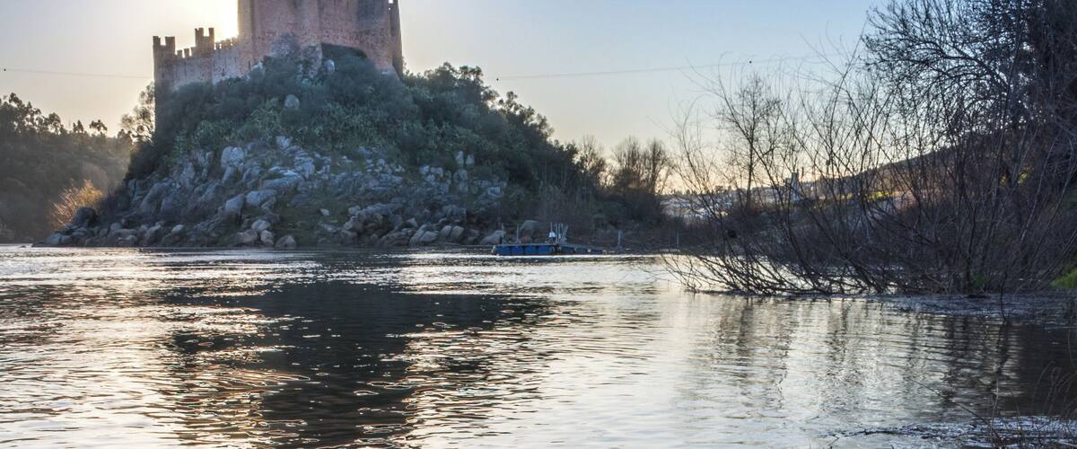 The castle is in a island in the middle of the river
You gonna find a few spot to shoot in the river boarder
At sunrise the sun is gonna light the castle from the front, and at sunset it's gonna be back light so try both