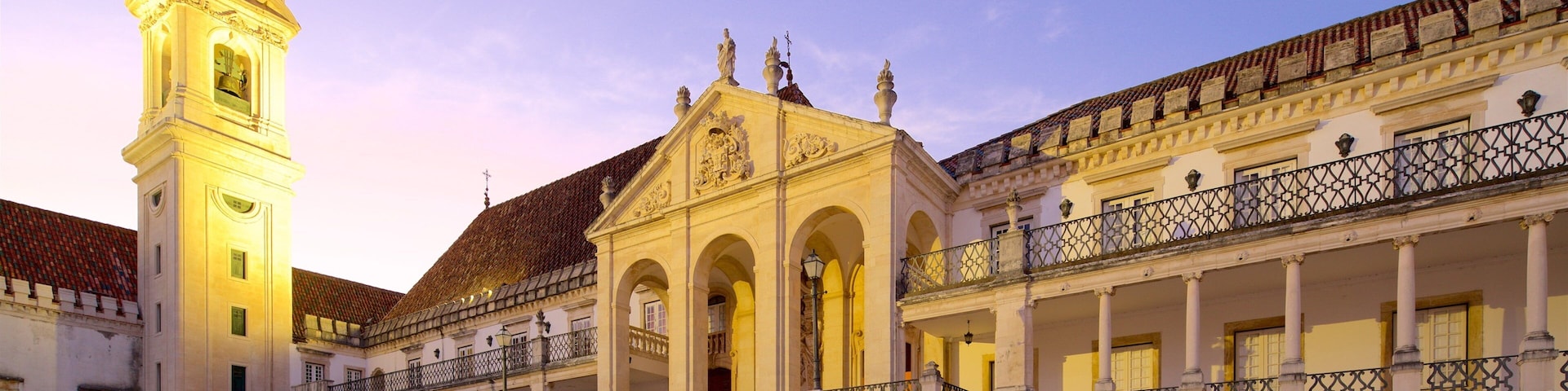 Coimbra University featuring heritage elements and a sunset