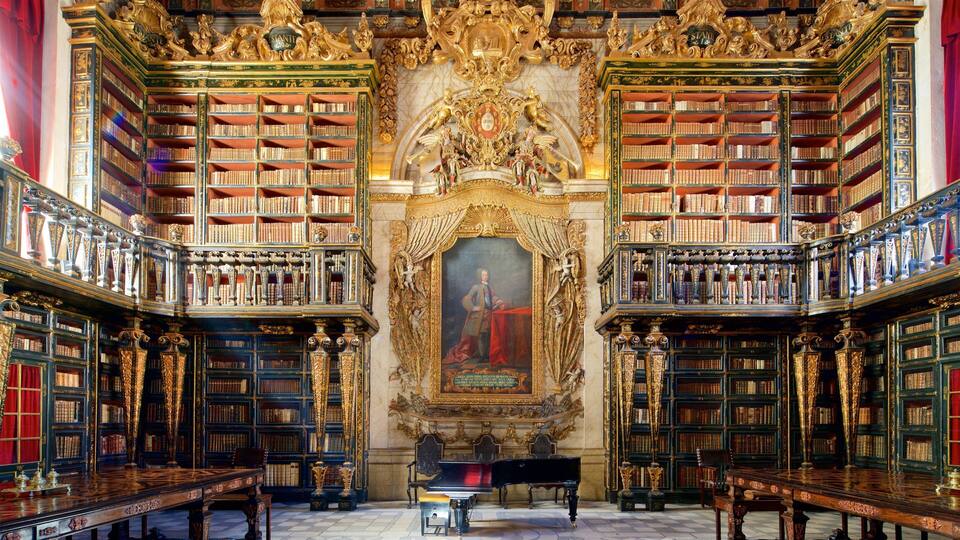 An ornate library with tall bookshelves, a grand piano, and a large portrait.