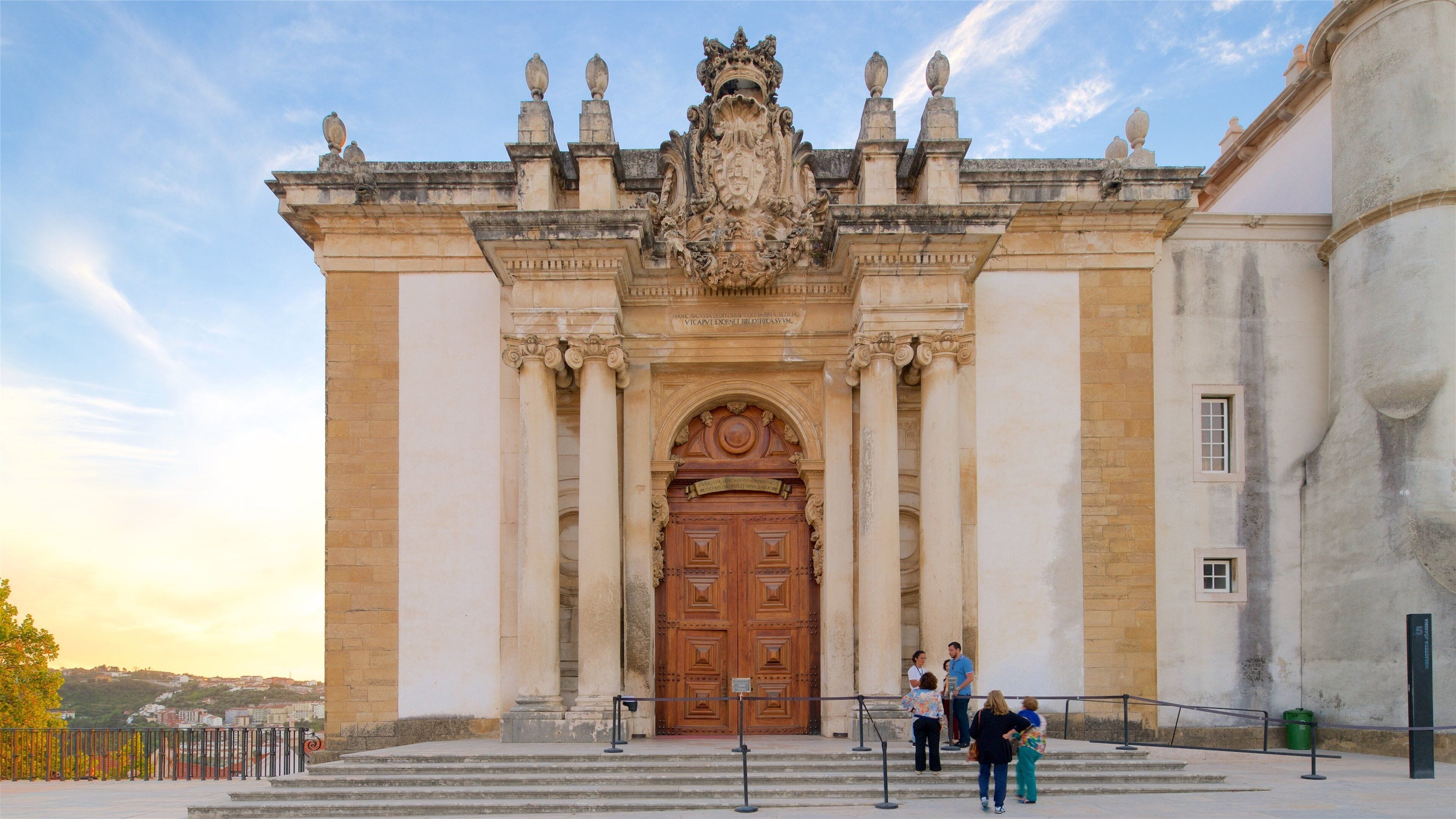 Biblioteca Joanina featuring heritage architecture, a church or cathedral and a sunset