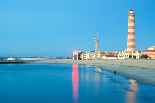 Barra Beach featuring a lighthouse, a coastal town and general coastal views