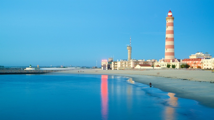 Barra Beach which includes a coastal town, a lighthouse and general coastal views