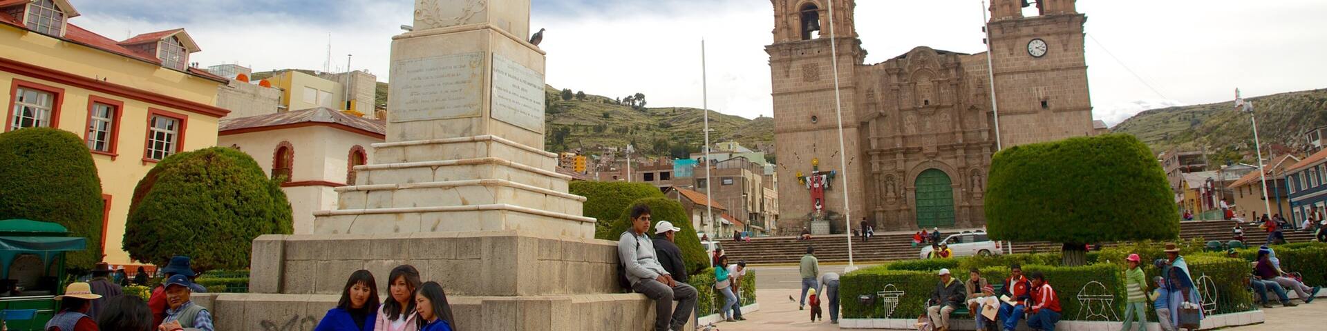 Lake Titicaca which includes a park and heritage architecture as well as a small group of people