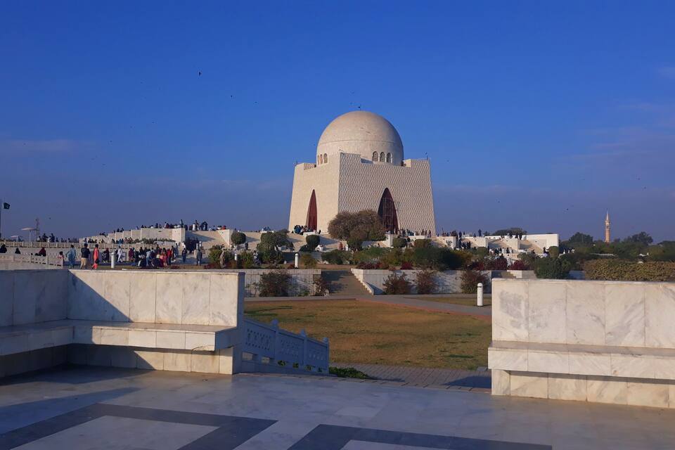 A large dome structure with people around it.