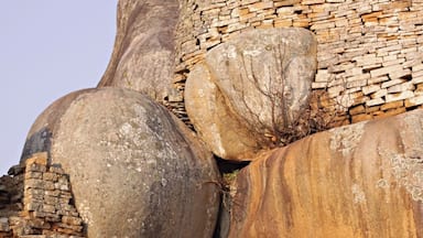 Large boulders and a stone wall.