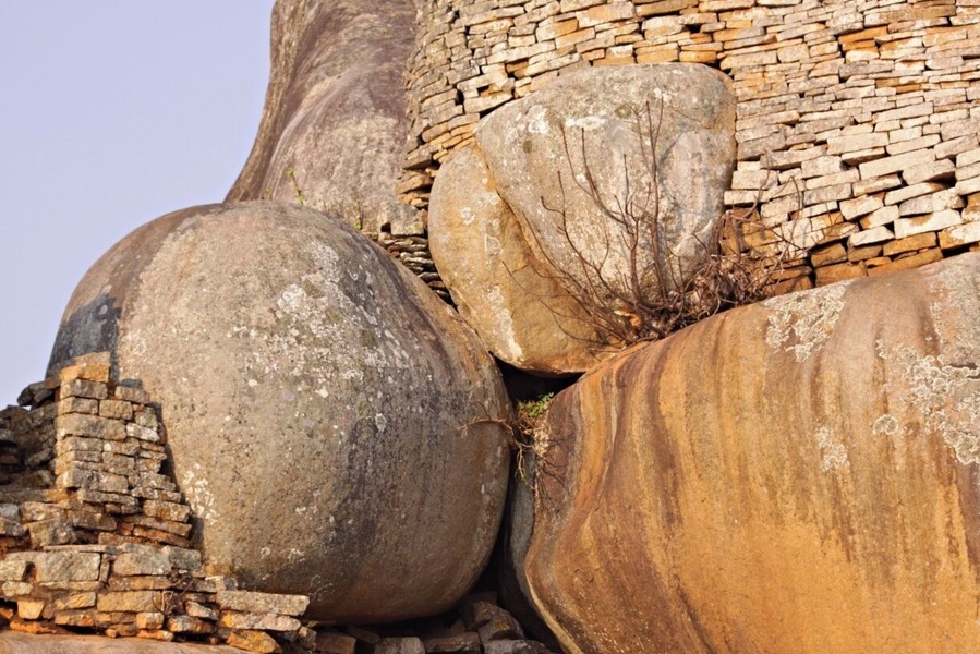 Close to the small city Masvingo in Zimbabwe you find the origin to the name Zimbabwe got in 1980. The name was already used by african nationalists around 1960 as a possible name for the country the day they got their freedom. The name comes from shona language and means ruins. In 1986 this amazing place was proclaimed a Unesco World Heritage Site. This is an amazing place and a must visit if you are in Zimbabwe.
Read more at: http://www.travelwithallsenses.com/great-zimbabwe-unesco-world-heritage-site/