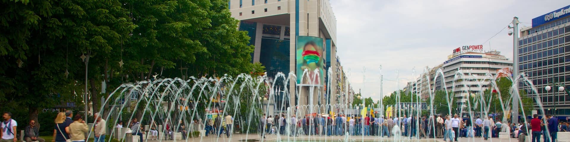 Kizilay Square which includes a fountain as well as a large group of people