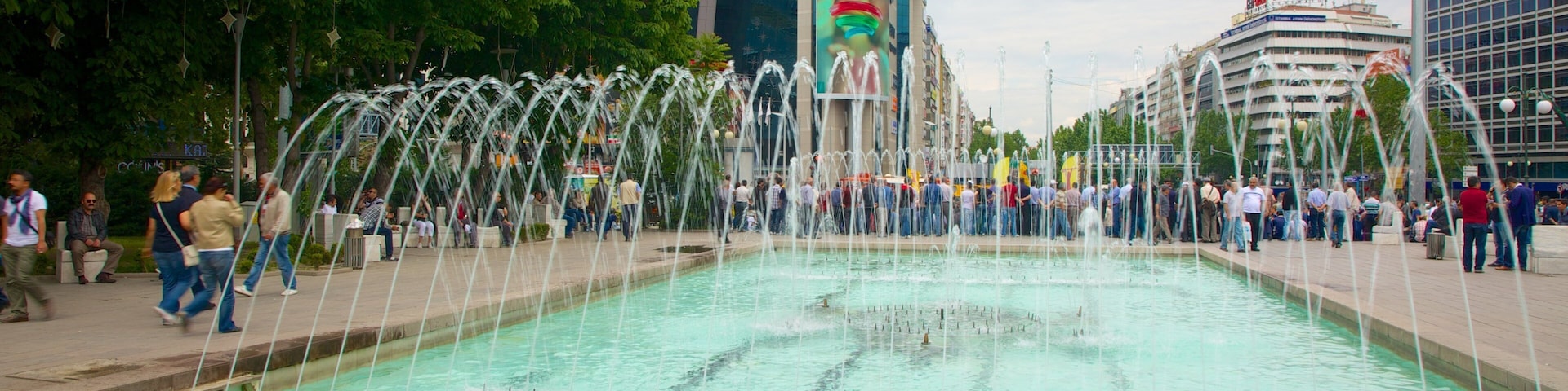 Kizilay Square which includes a fountain as well as a large group of people