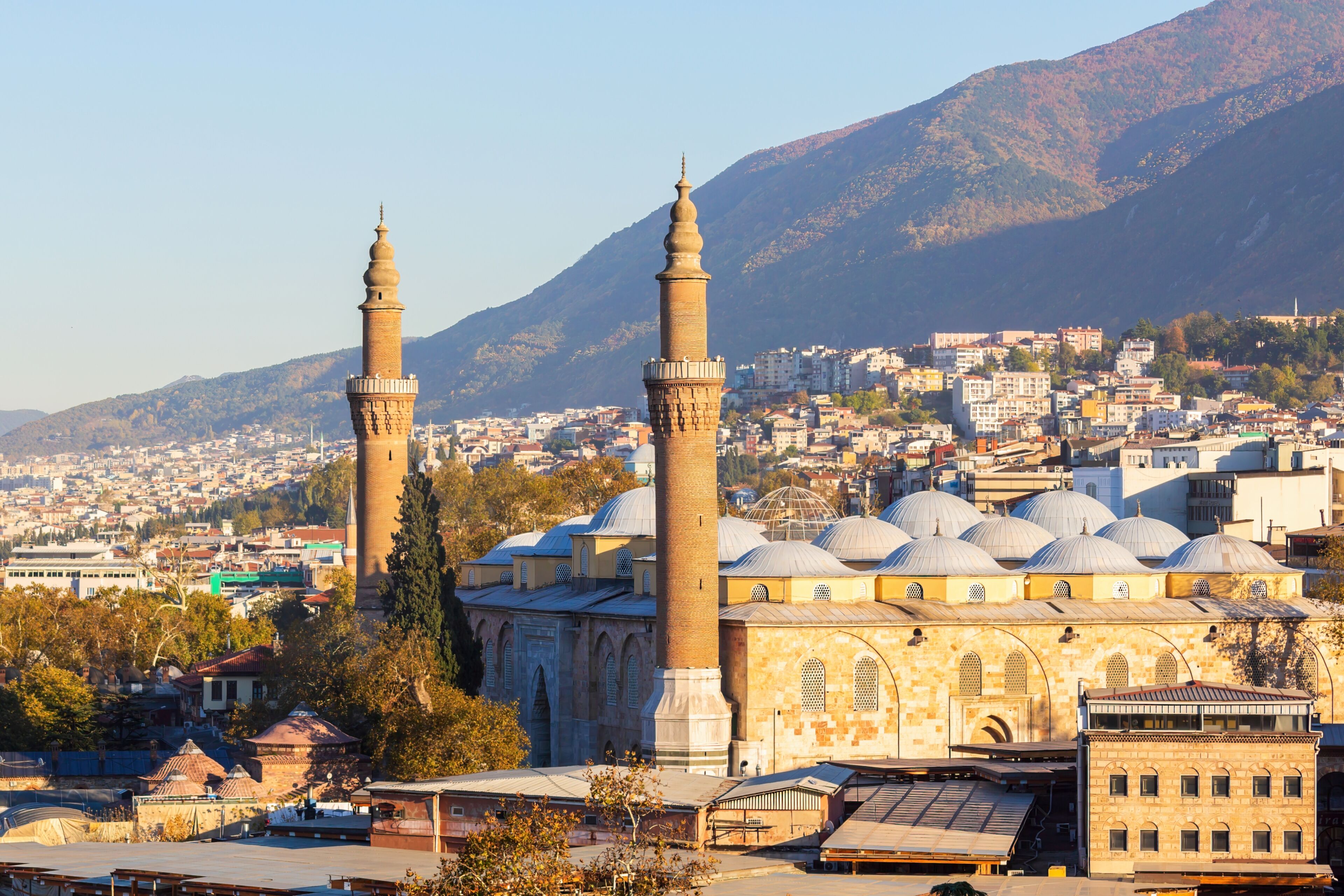 View of Bursa Grand Mosque/Ulu Cami from the hill. Cityscape and the slope of Uludag mountain at background. Bursa,Turkey.