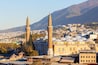 View of Bursa Grand Mosque/Ulu Cami from the hill. Cityscape and the slope of Uludag mountain at background. Bursa,Turkey.