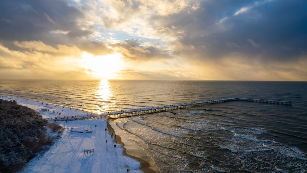 Aerial winter sunny frozen day view of snowy resort Palanga, Lithuania