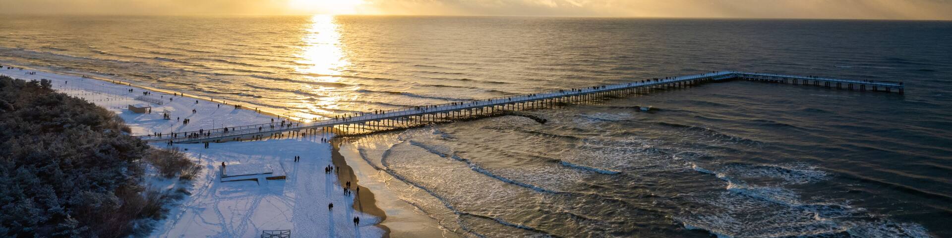 Aerial winter sunny frozen day view of snowy resort Palanga, Lithuania
